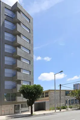 a rendering of a tall building on a street at FLH Boavista Woody Duplexes in Porto