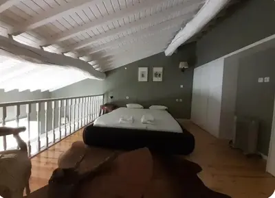 a bedroom with a large bed in a room at Mezzanine in Porto