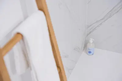a bottle of soap sitting on the corner of a wall at GuestReady - Downtown Refuge with Private Parking in Porto