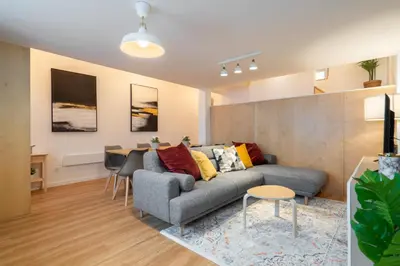 a living room with a couch and a table at Host Wise - Central Duplex House - Terrace in Vila Nova de Gaia