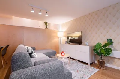 a living room with a couch and a tv at Host Wise - Central Duplex House - Terrace in Vila Nova de Gaia