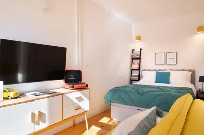 a white bathroom with a sink and a shower at *Lighty Santa Catarina Studio* Balcony/Dishwasher in Porto