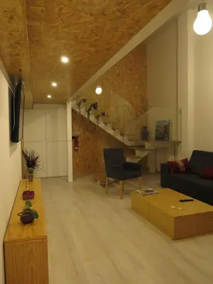 a living room with a couch and a table at Porto Encanto- 7 Bedrooms in Porto