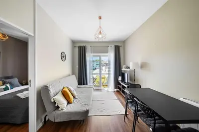 a living room with a couch and a table at Apartamento D' Alegria in Porto
