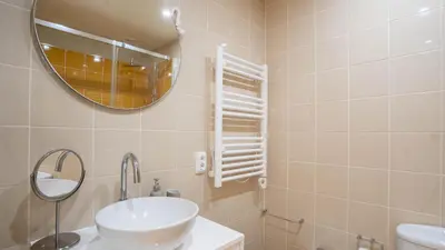 a bathroom with a sink and a mirror at Capelo Residency by LovelyStay in Porto