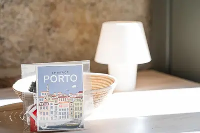 a book sitting on a table next to a lamp at GuestReady - Porto's Charming Escape in Porto