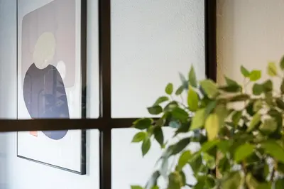 a close up of a window with a plant at GuestReady - Modern Home In Gaia in Vila Nova de Gaia