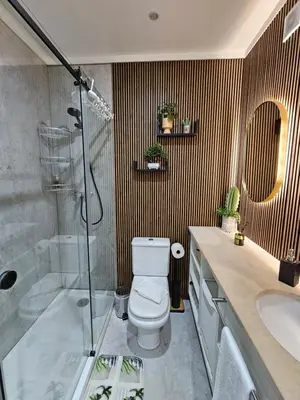 a bathroom with a toilet and a shower and a sink at Porto Central Terrace Apartment in Porto