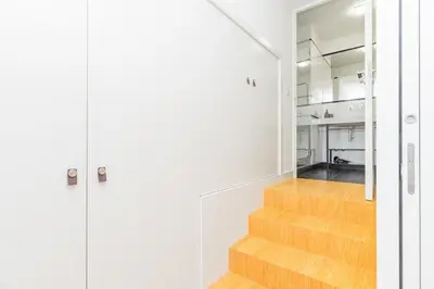 a staircase in a house with white walls and wooden floors at Charming Apartment • Porto in Porto