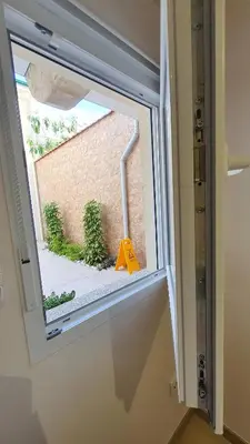 a window with a caution sign in a room at Bedroom with private bathroom in the city center, next to the subway in Porto