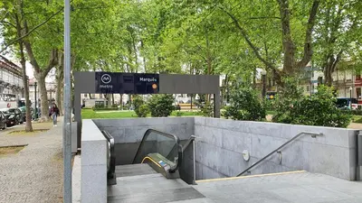 a sign at a bus stop in a city at Bedroom with private bathroom in the city center, next to the subway in Porto