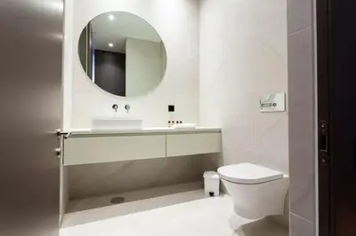 a bathroom with a sink and a toilet and a mirror at Dream on - Flow in Porto