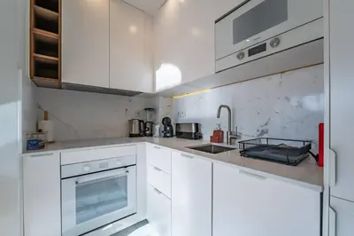 a kitchen sink with a sign that reads there is no place like home at Brittos Avenue Apartment in Gaia in Vila Nova de Gaia