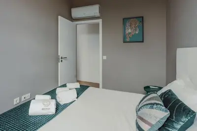 a living room with a couch and a table at Mira Alfandega apartment in Porto
