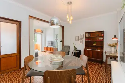 a dining room with a table and chairs at Liiiving in Porto - Vintage Design Apartment in Porto