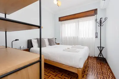 a bedroom with a bed and a bunk bed at Liiiving in Porto - Vintage Design Apartment in Porto