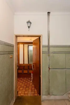 an orange and white balcony with a table and chairs at Liiiving in Porto - Vintage Design Apartment in Porto