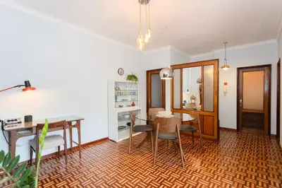 a room with two beds and a closet at Liiiving in Porto - Vintage Design Apartment in Porto