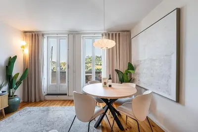 a dining room with a table and chairs at GuestReady - An urban retreat with river view in Porto