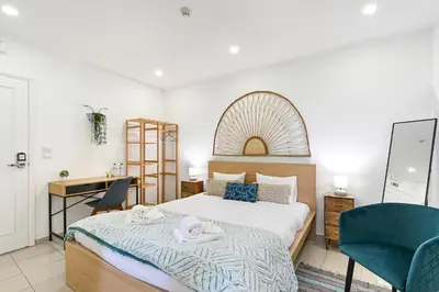 a bedroom with a bed and a desk and a chair at Casa Maya in Porto