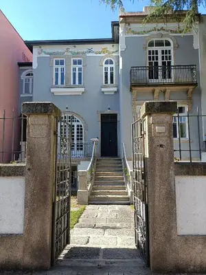 an entrance to a house with a gate and stairs at Casa D'Almeida by Porto Stories in Porto