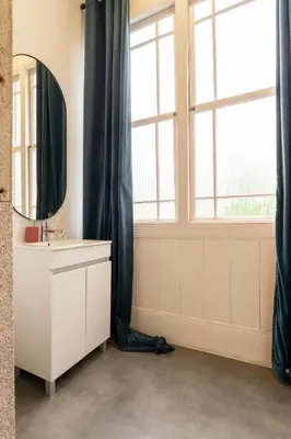 a bathroom with a sink and a mirror at Casa D'Almeida by Porto Stories in Porto