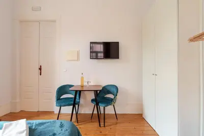 a dining room with a table and two chairs at Casa D'Almeida by Porto Stories in Porto