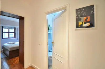 a hallway with a door to a room with a bedroom at Lips Friendship Shelter in Porto