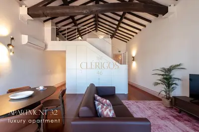 a mirror reflection of a bed in a bedroom at The Clérigos 46 in Porto