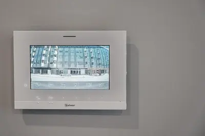 a television with a picture of a building at GuestReady - Lovely city retreat in Boavista in Porto