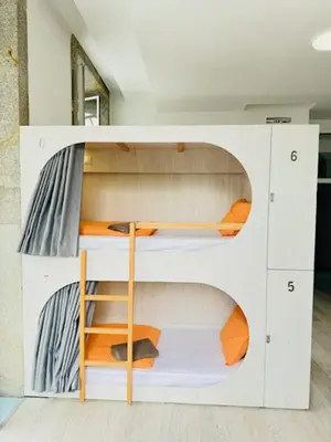 a white bunk bed in a room at Fantasy Hostel Porto in Porto