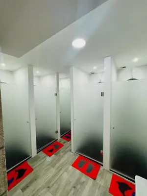 a room with doors and red mats on the floor at Fantasy Hostel Porto in Porto