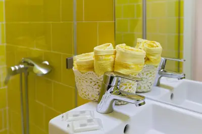 a bathroom with a sink with baskets on a sink at Merc Porto Vitoria's Place in Porto
