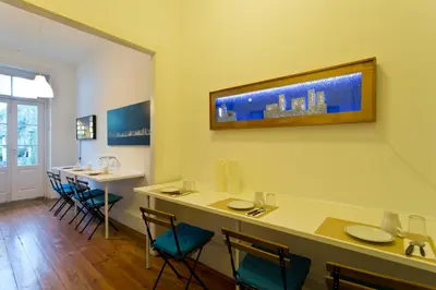 a dining room with a table and chairs at Hostel Alegria in Porto