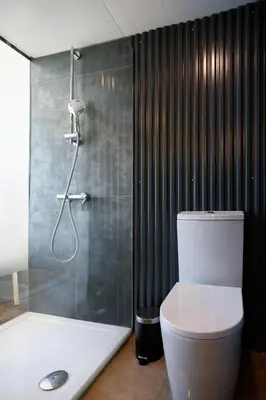 a bathroom with a shower with a toilet and a glass showerintendent at Live In Porto - Codeçal in Porto