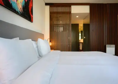a bedroom with a large white bed with white pillows at Live In Porto - Codeçal in Porto