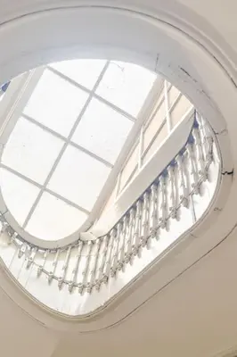 a skylight in a building with a window at Modern Downtown Studio in Porto