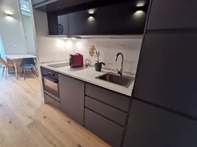 a kitchen with a sink and a counter top at Modern Downtown Studio in Porto