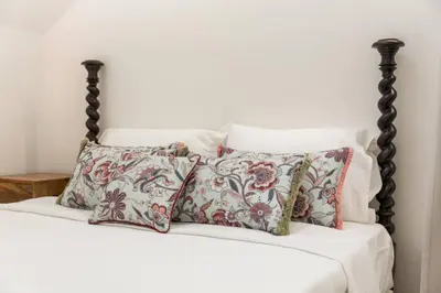 a bedroom with a bed and a flat screen tv at Beco do Paço by Porto Dream Stays in Porto