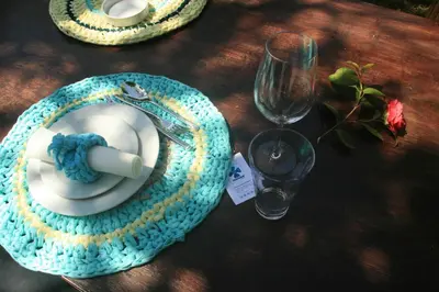 a table with a plate with a candle and a glass at Oporto Loft in Porto