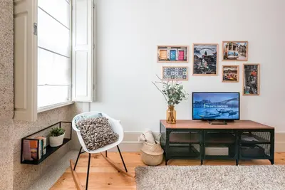 a living room with a desk and a chair at GuestReady - Oporto Temptation Apartment in Porto