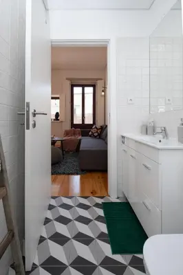 a kitchen with a sink and a counter top at Host Wise - Sunny Downtown Apartment in Porto