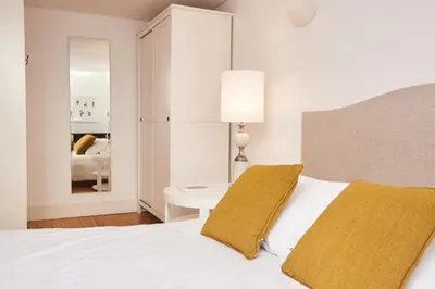 a white bedroom with a bed and a white table at ChillHouse_Porto in Porto