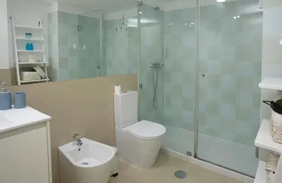 a bathroom with a shower and a toilet and a sink at ChillHouse_Porto in Porto