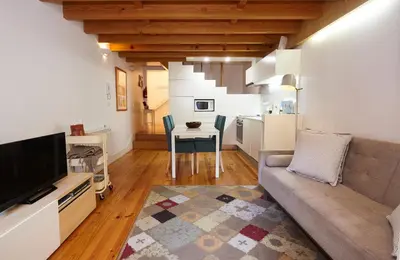 a living room with a couch and a table at ChillHouse_Porto in Porto
