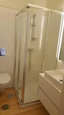 a bathroom with a shower and a toilet and a sink at GuestReady - Catorze de Outubro Houses 427 in Vila Nova de Gaia