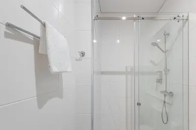 a bathroom with a shower with a glass door at GuestReady - Port Studio 1 in Vila Nova de Gaia