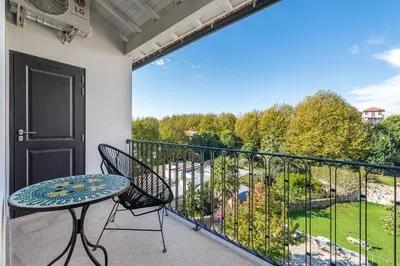 a patio with a table and chairs on a balcony at GuestReady - Loft 515 in Porto