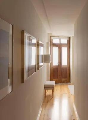 a room with a bench and a window and a door at GuestReady - Catorze de Outubro Houses - 387 in Vila Nova de Gaia