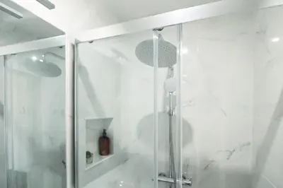 a shower in a bathroom with a glass door at Lady Lapa by Lady Collection in Porto